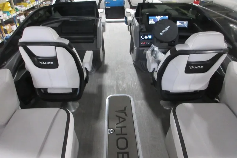 Slide: The Image of Interior of a 2026 Tahoe boat with modern seating and dashboard. - 11