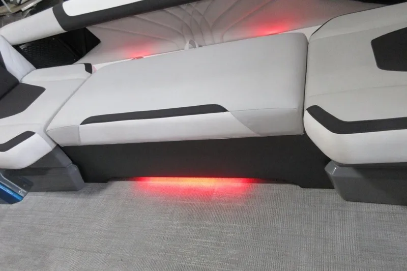 Slide: The Image of 2026 Tahoe boat interior with illuminated seating and modern design. - 12
