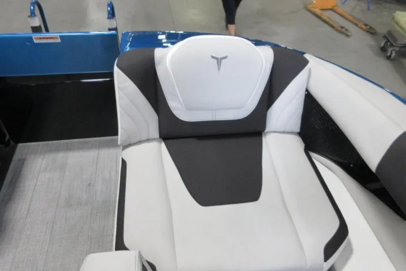 Slide: The Image of 2026 Tahoe boat seat with modern black and white design in a showroom setting. - 13