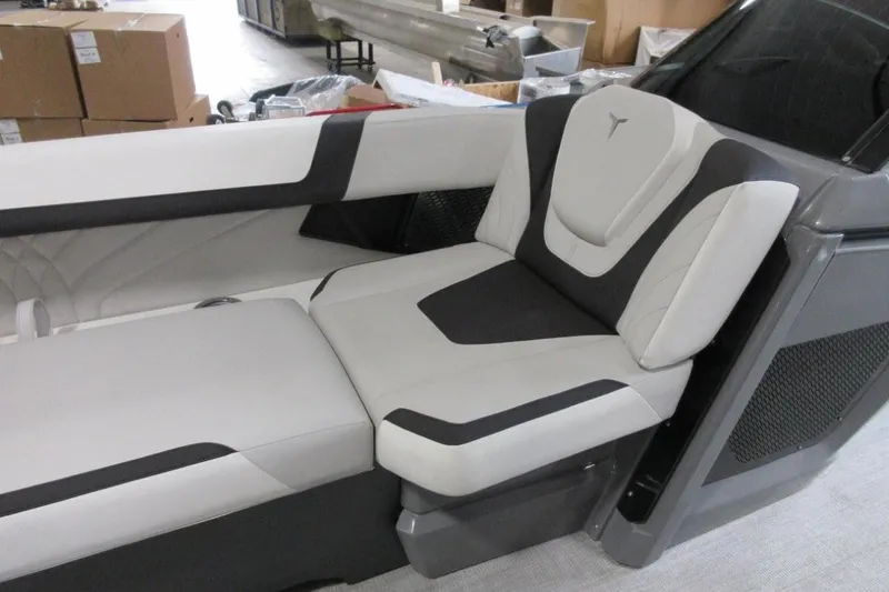 Slide: The Image of Luxurious 2026 Tahoe boat seating with sleek black and white design in a modern interior. - 16