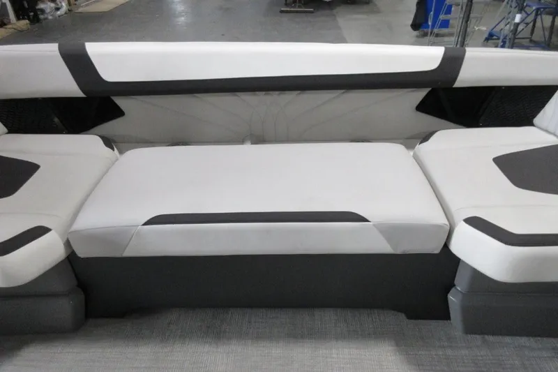 Slide: The Image of 2026 Tahoe boat interior seating with modern white and black upholstery design. - 19