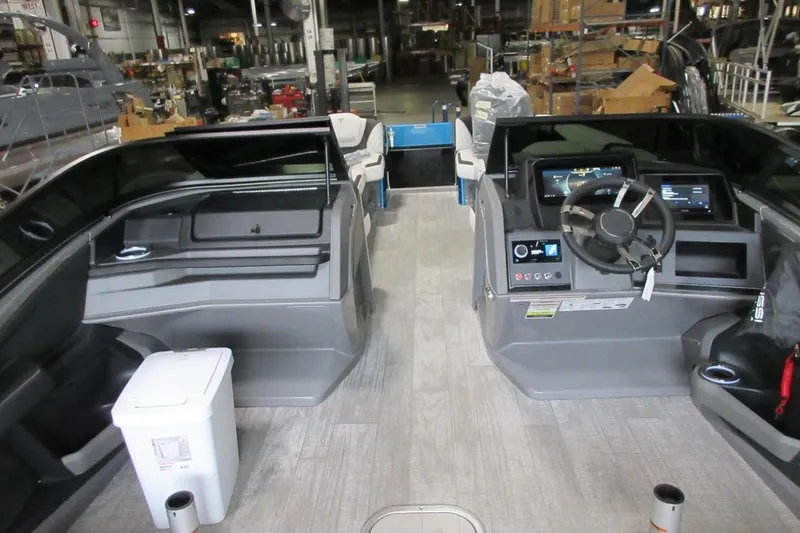 Slide: The Image of Interior view of a 2026 Tahoe boat with modern dashboard and seating. - 25