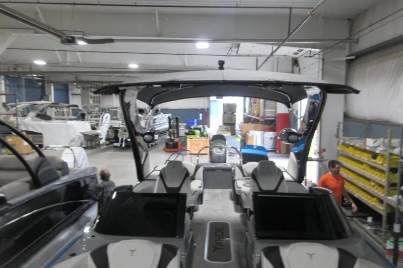 Slide: The Image of 2026 Tahoe boat in a warehouse, showcasing sleek design and modern features. - 31