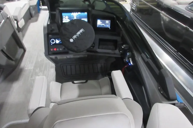 Slide: The Image of 2026 Tahoe boat cockpit with modern controls and comfortable seating. - 32