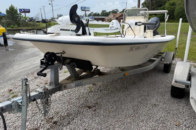 Slide: The Image of 2006 Jones Brothers Bateau 17 boat on trailer, parked on gravel. - 4