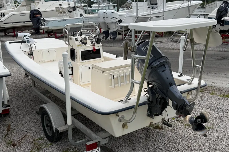 Slide: The Image of 2006 Jones Brothers Bateau 17 boat with outboard motor on trailer. - 6