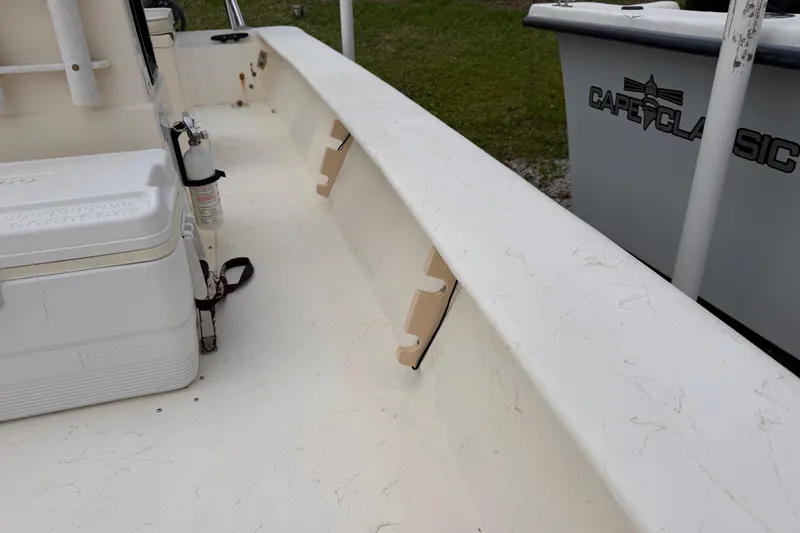Slide: The Image of 2006 Jones Brothers Bateau 17 boat interior with cooler and fire extinguisher. - 7