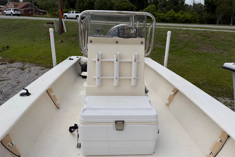 Slide: The Image of 2006 Jones Brothers Bateau 17 boat interior with console and cooler on deck. - 9
