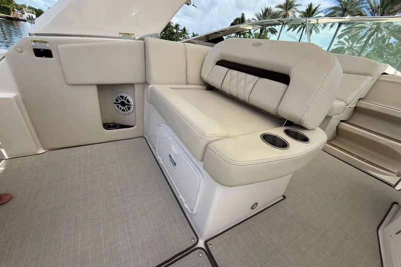 Slide: The Image of Luxurious seating on 2022 Regal 33 XO boat with cup holders and speaker. - 11