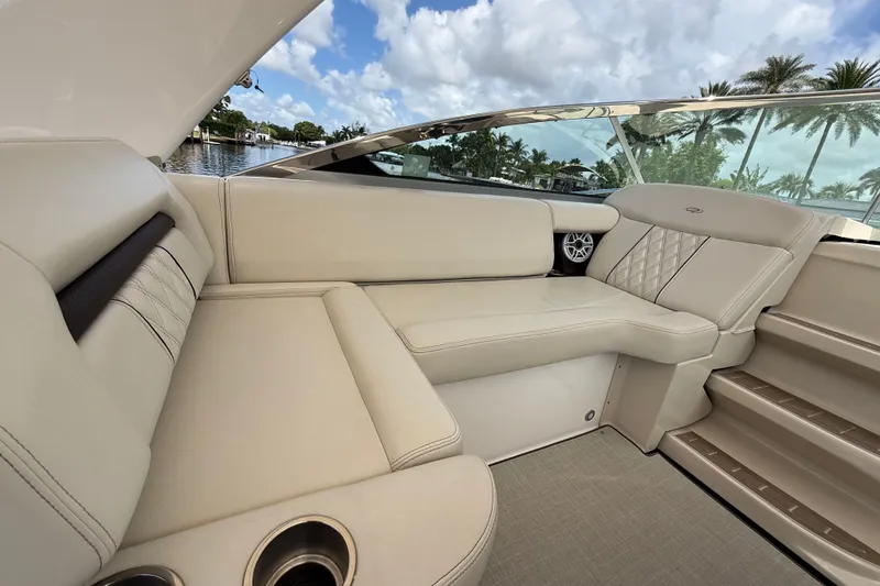 Slide: The Image of Luxurious interior of 2022 Regal 33 XO boat with plush seating and scenic view. - 14