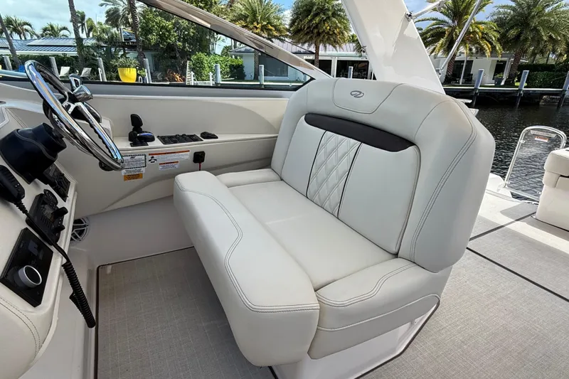 Slide: The Image of Luxurious interior of 2022 Regal 33 XO boat with plush seating and modern controls. - 15