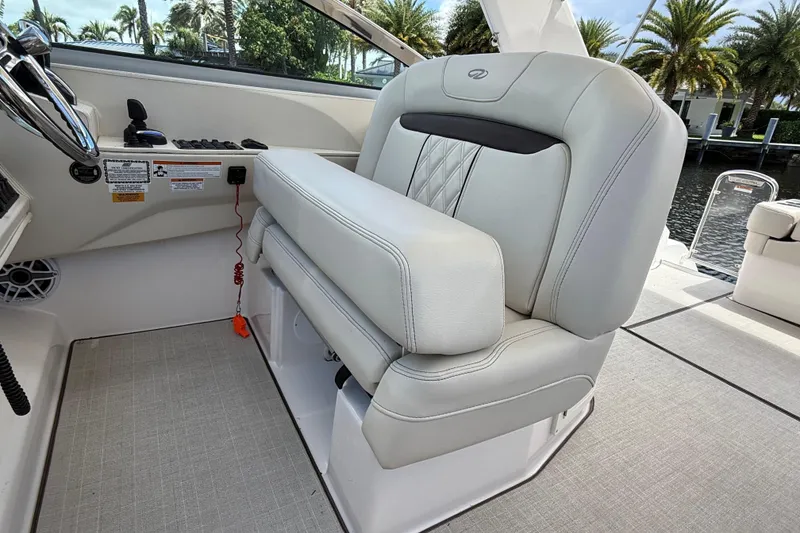 Slide: The Image of Luxury helm seat on 2022 Regal 33 XO boat, featuring elegant design and premium materials. - 16