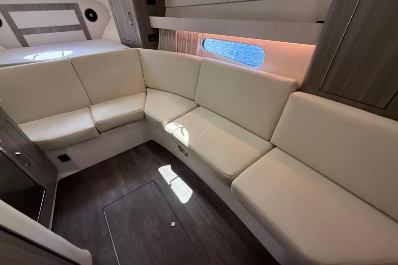 Slide: The Image of Luxurious interior seating of 2022 Regal 33 XO yacht with elegant design. - 18