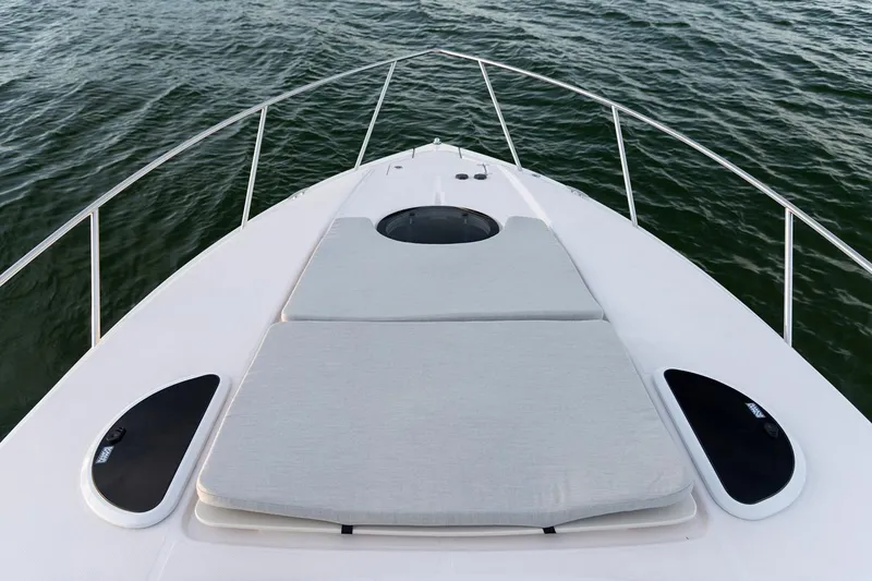 Slide: The Image of Manufacturer Provided Image: 2022 Regal 33 XO boat bow with sunpad and ocean view. - 24