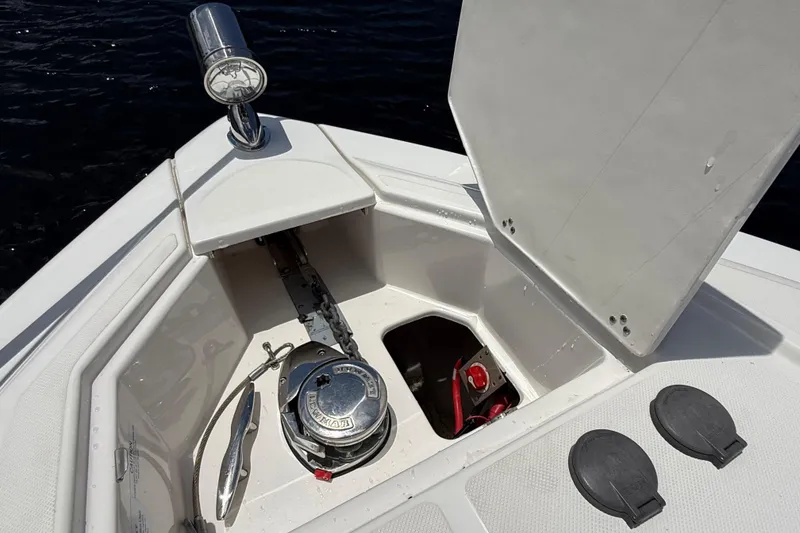 Slide: The Image of Anchor compartment of 2022 Regal 33 XO boat with open hatch. - 26