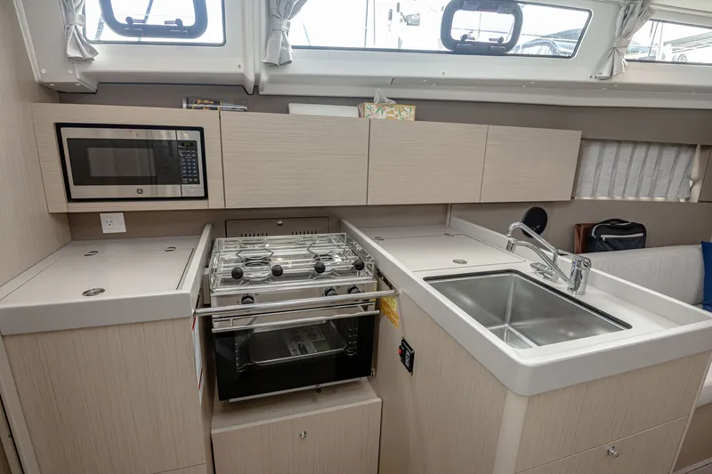 Slide: The Image of Interior of Beneteau Oceanis 38.1 yacht kitchen, year 2023. - 3