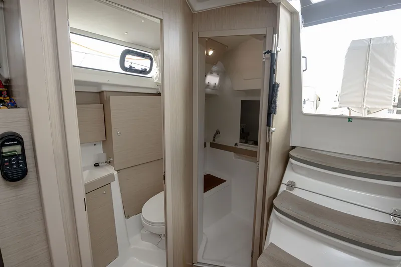 Slide: The Image of Interior of 2023 Beneteau Oceanis 38.1 yacht, featuring bathroom and stairs. - 7