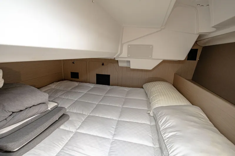 Slide: The Image of Interior of 2023 Beneteau Oceanis 38.1 yacht with cozy bed. - 9