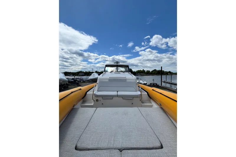 Slide: The Image of 2020 Protector 380 Targa boat docked under a partly cloudy sky. - 13