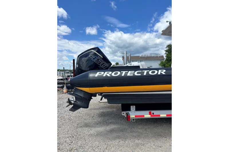 Slide: The Image of Protector 380 Targa 2020 boat with powerful outboard motor on a trailer. - 14