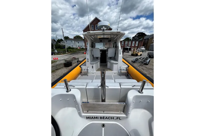 Slide: The Image of 2020 Protector 380 Targa boat docked, featuring spacious seating and Miami Beach, FL label. - 17