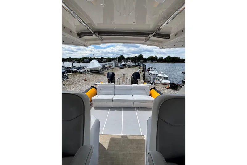 Slide: The Image of Interior view of 2020 Protector 380 Targa boat docked by the waterfront. - 18
