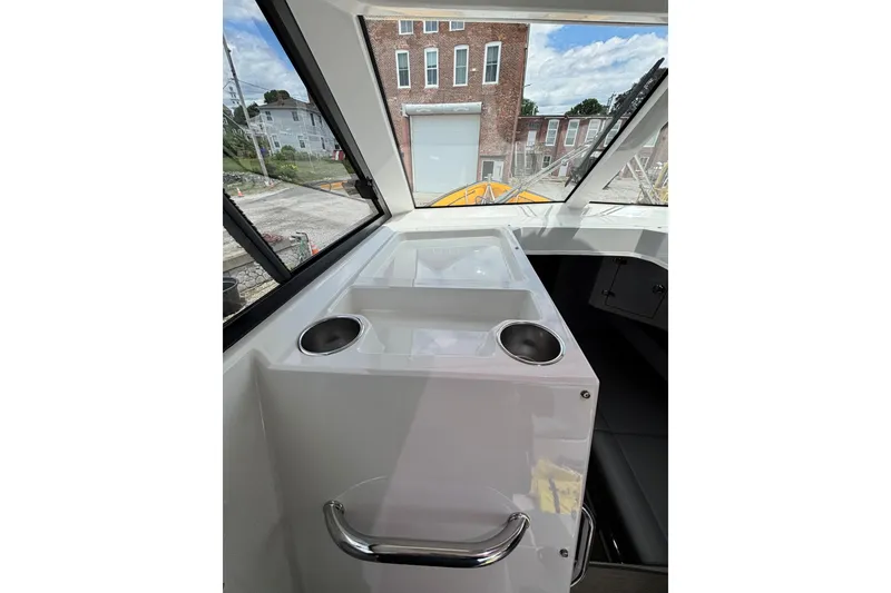 Slide: The Image of Interior view of 2020 Protector 380 Targa boat with cup holders and windows. - 20