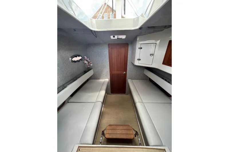 Slide: The Image of Interior of 2020 Protector 380 Targa boat, featuring sleek seating and modern design elements. - 22