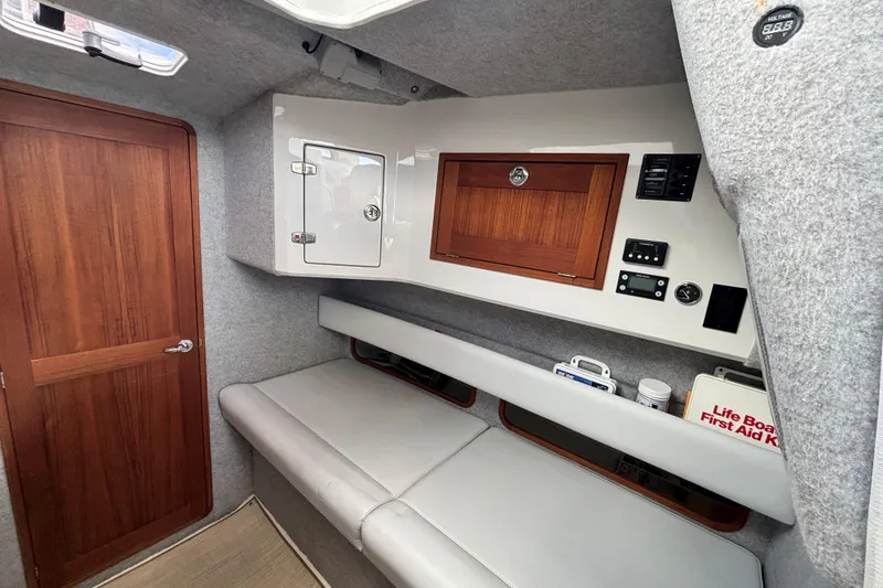 Slide: The Image of Interior cabin of 2020 Protector 380 Targa boat with seating and storage. - 23