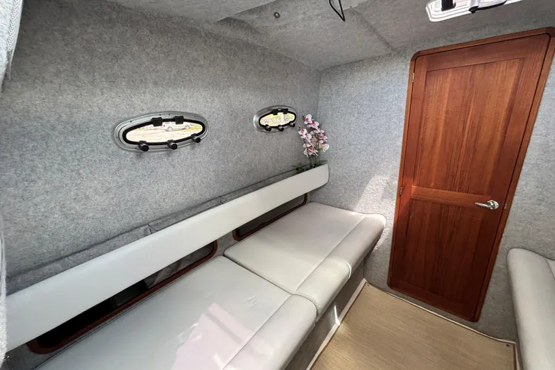 Slide: The Image of Interior cabin of 2020 Protector 380 Targa boat with seating and wooden door. - 24