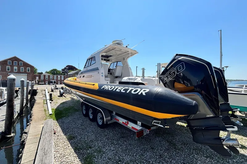 Slide: The Image of 2020 Protector 380 Targa boat on trailer with powerful outboard engines. - 3