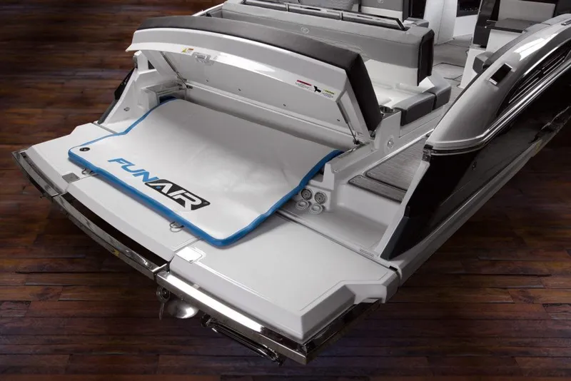 Slide: The Image of Manufacturer Provided Image: 2025 Cobalt A29 boat with FunAir inflatable platform on wooden deck. - 13