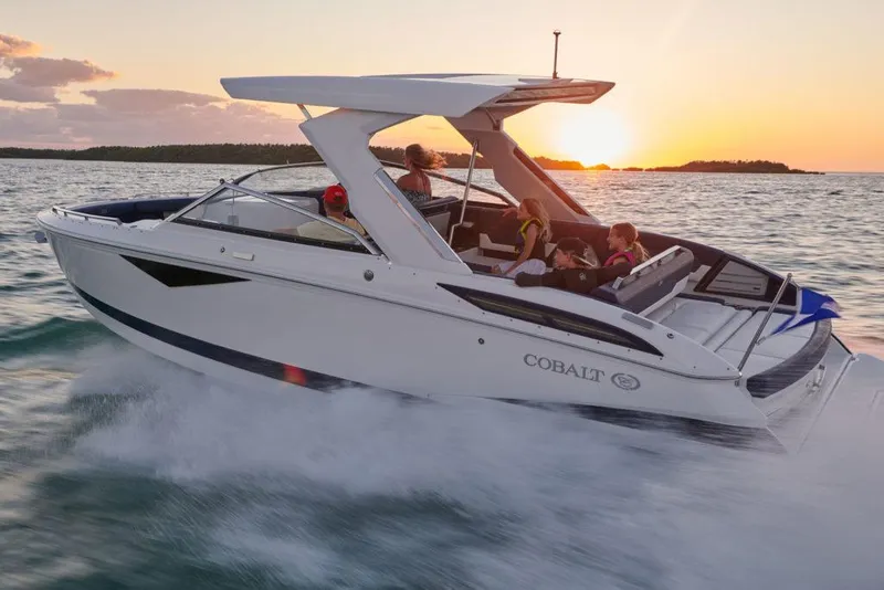 Slide: The Image of Manufacturer Provided Image: 2025 Cobalt A29 boat cruising at sunset on open water. - 2