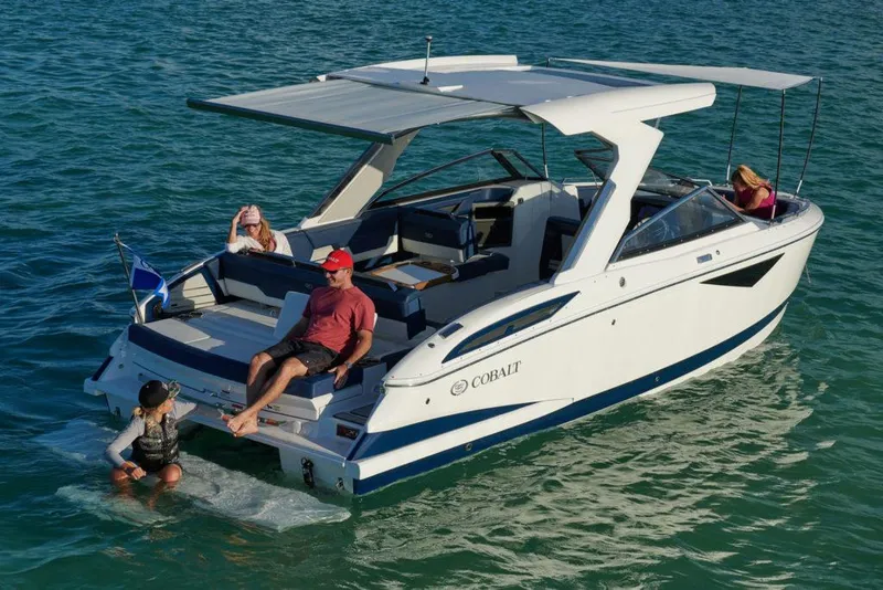 Slide: The Image of Manufacturer Provided Image: 2025 Cobalt A29 boat with people relaxing on deck in clear blue water. - 3