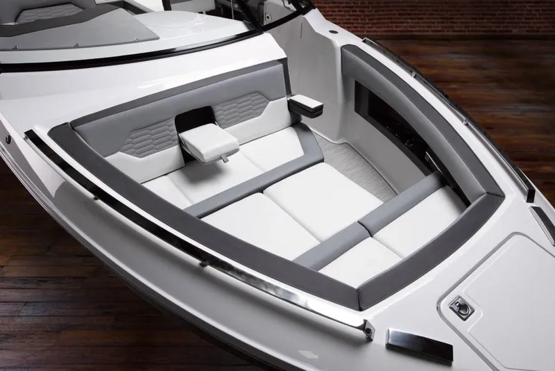 Slide: The Image of Manufacturer Provided Image: 2025 Cobalt A29 boat interior with sleek white and gray seating design. - 6