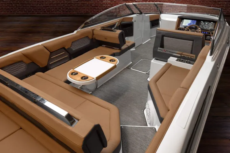 Slide: The Image of Manufacturer Provided Image: 2025 Cobalt A29 boat interior with luxurious brown seating and modern dashboard. - 7