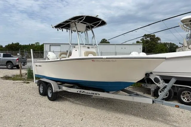 The Image of 2019 Sea Born LX21 Center Console boat on trailer, parked outdoors. - 0