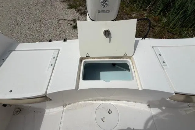 Slide: The Image of 2019 Sea Born LX21 Center Console boat with open storage compartments. - 15