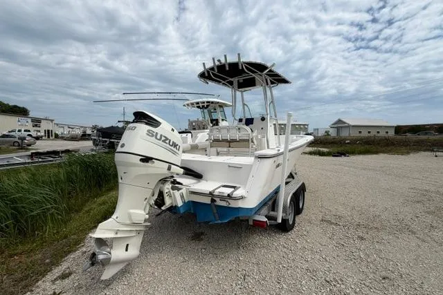 Slide: The Image of 2019 Sea Born LX21 Center Console boat with Suzuki outboard motor on a trailer. - 3