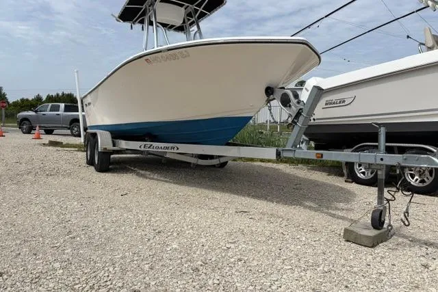 Slide: The Image of 2019 Sea Born LX21 Center Console boat on trailer, parked outdoors. - 4