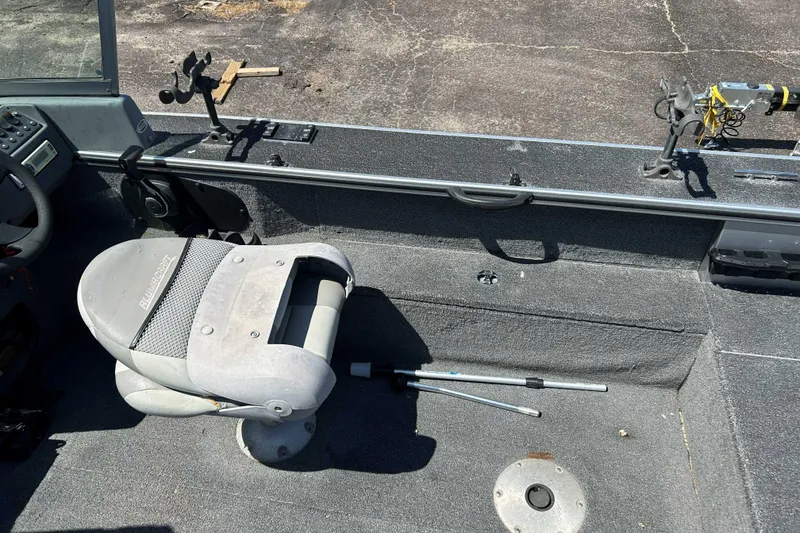 Slide: The Image of 2007 Alumacraft Dominator 175 Sport boat interior with seating and fishing rod holders. - 6