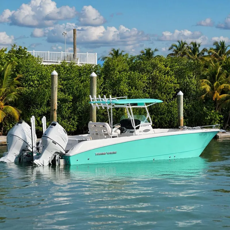 The Image of 2023 Twin Vee 240 GFX CC boat on calm water. - 0
