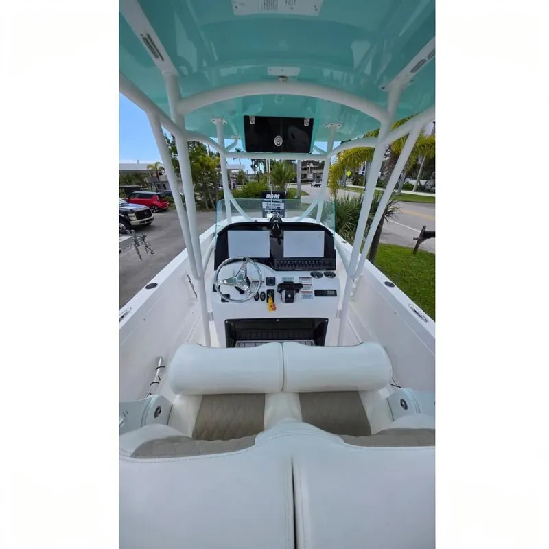 Slide: The Image of 2023 Twin Vee 240 GFX CC boat interior with modern helm and seating. - 6