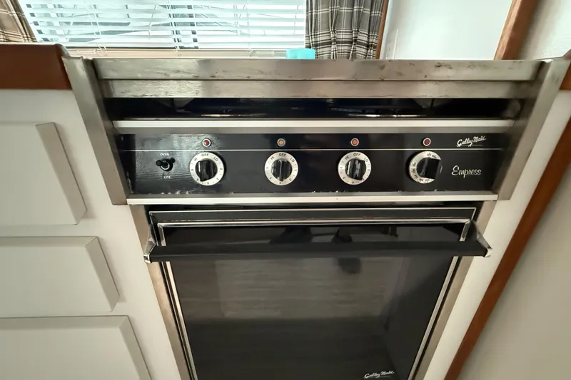 Slide: The Image of Vintage Galley Maid Empress stove in 1995 Harbor Master 52 Wide Body yacht kitchen. - 16