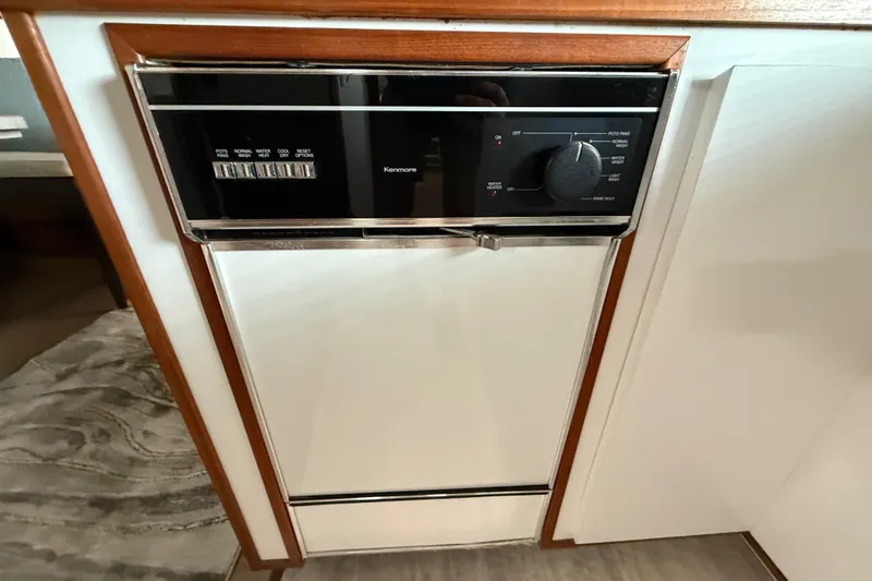 Slide: The Image of Built-in Kenmore dishwasher on 1995 Harbor Master 52 Wide Body yacht. - 17