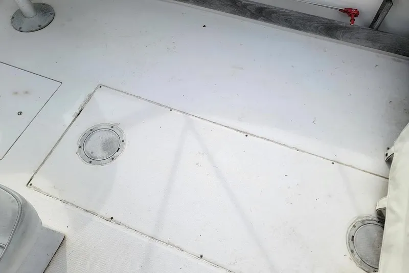 Slide: The Image of Deck of 1988 Grady-White Freedom 192 boat, featuring clean white surface. - 8