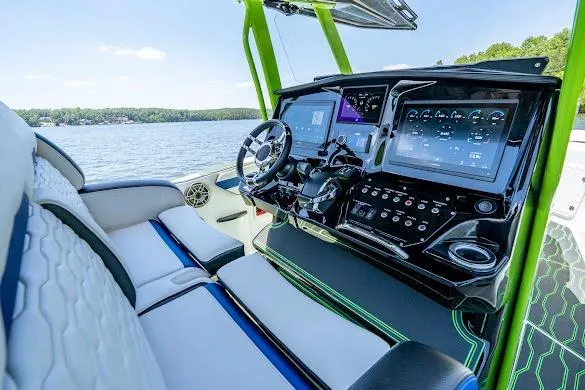 Slide: The Image of 2024 Sunsation 32 CCX boat cockpit with advanced navigation displays and luxurious seating. - 35