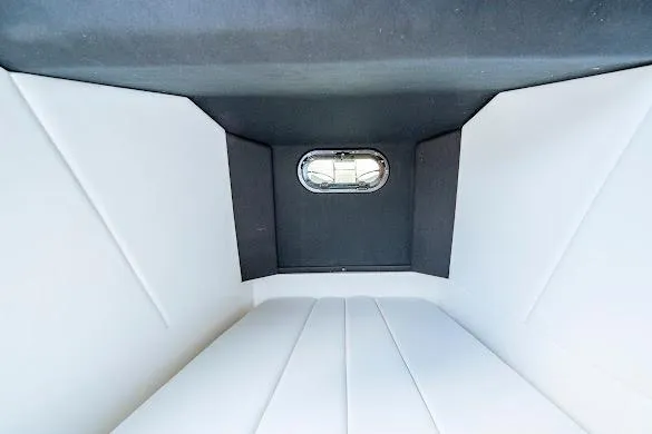 Slide: The Image of Interior cabin of 2024 Sunsation 32 CCX boat, featuring sleek design and window. - 40