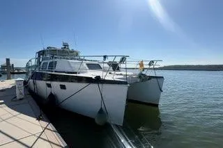 The Image of 2006 Endeavour 44 TrawlerCat docked under clear blue sky. - 1