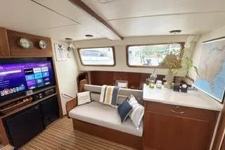 Slide: The Image of Interior of 2006 Endeavour 44 TrawlerCat with cozy seating and entertainment system. - 10